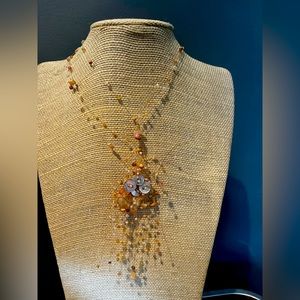 Handmade by an artist. Beaded adjustable necklace. Very delicate.